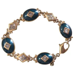 Vintage Burberrys golden gorgeous bracelet with oval emerald green and diamond shape charms with rhinestone crystals. Burberry jewelry.