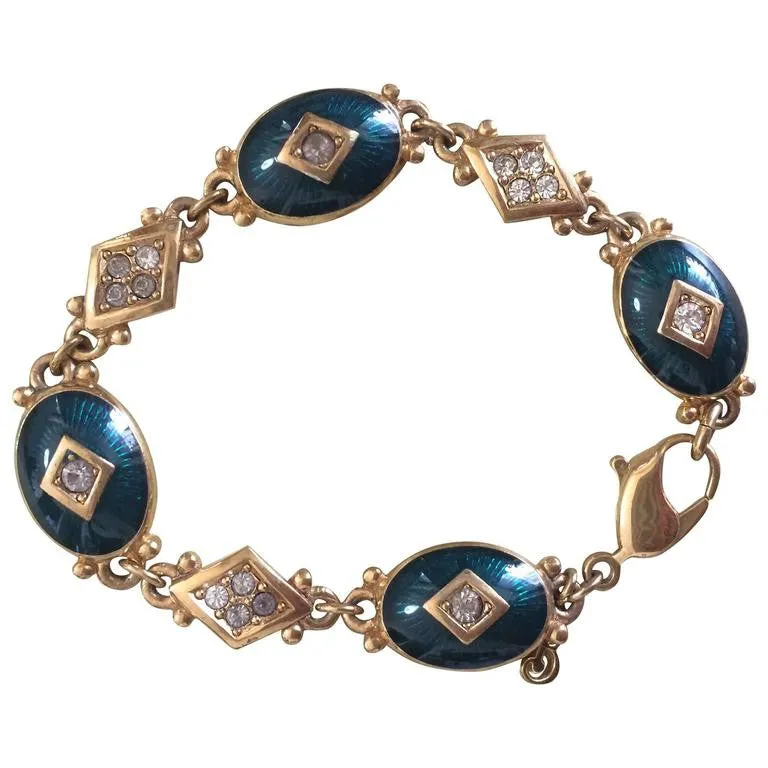 Vintage Burberrys golden gorgeous bracelet with oval emerald green and diamond shape charms with rhinestone crystals. Burberry jewelry.